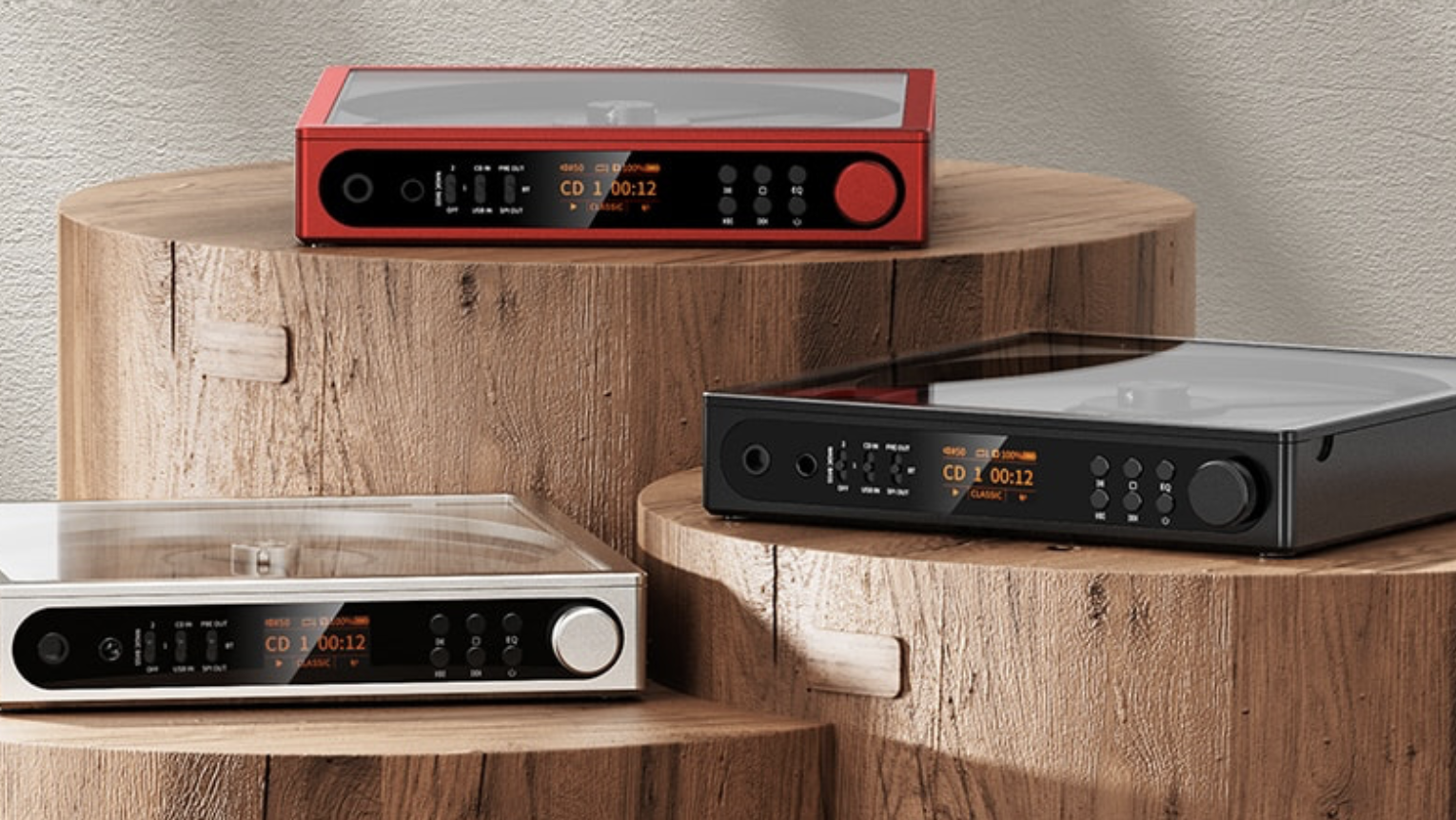 FiiO DM15 R2R players in red, silver and gray, on wooden tables