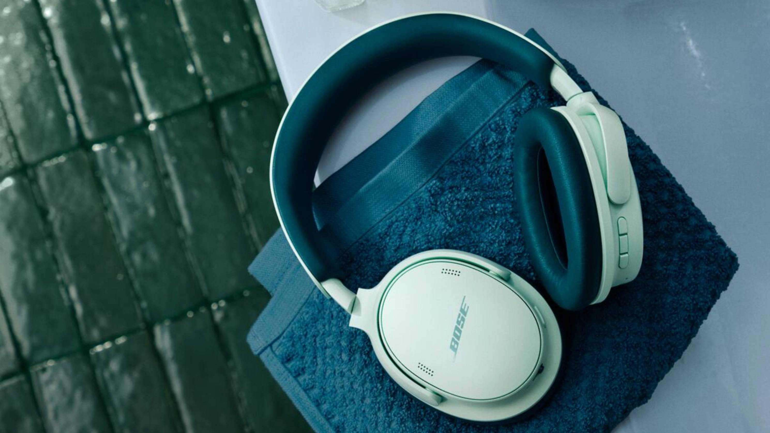 The Bose QuietComfort Headphones (2nd Gen) in Dewdrop Mint on top of a towel.